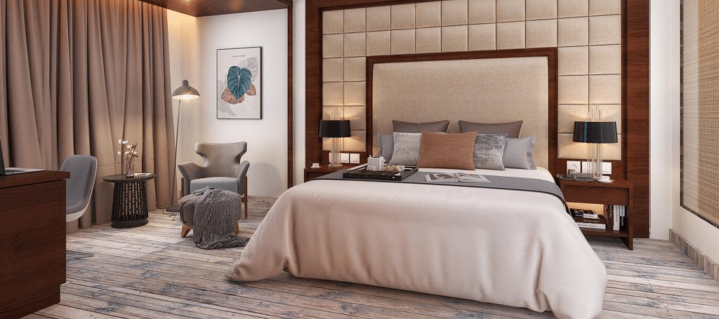Suite with a king size bed and lamps on each side of the bed at BluSalzz Residence, Amritsar.